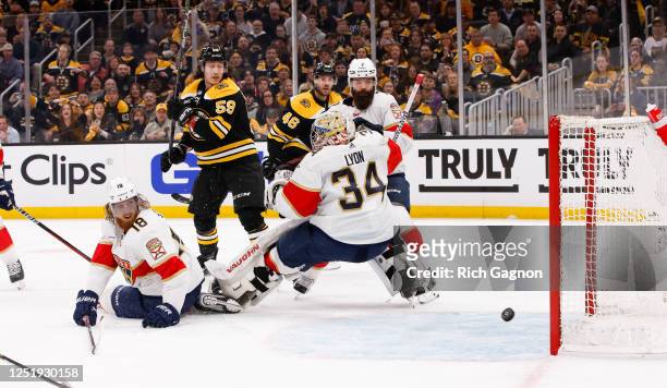 David Pastrnak of the Boston Bruins scores against Alex Lyon of the Florida Panthers during the first period of Game One of the First Round of the...