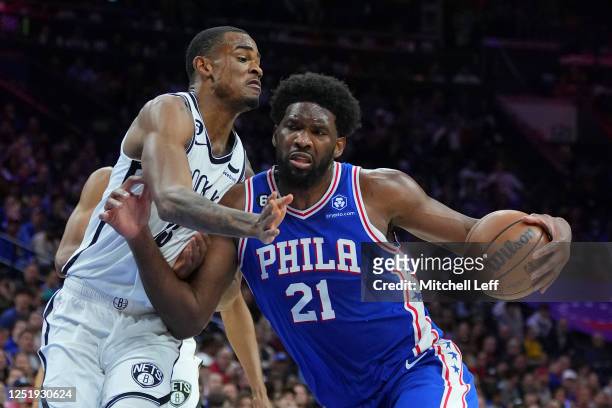Joel Embiid of the Philadelphia 76ers drives to the basket against Nic Claxton of the Brooklyn Nets in the first quarter during Game Two of the...