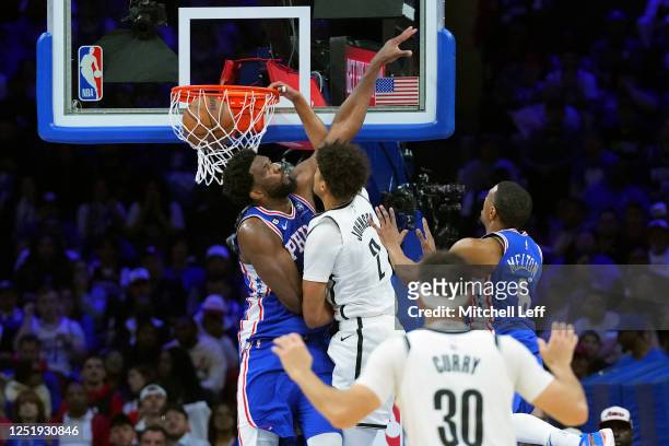 Cameron Johnson of the Brooklyn Nets dunks the ball against Joel Embiid of the Philadelphia 76ers in the second quarter during Game Two of the...