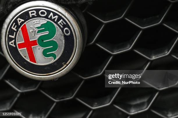 Logo seen on ALFA ROMEO vehicle parked in Krakow center, on Monday, April 17 in Krakow, Poland.