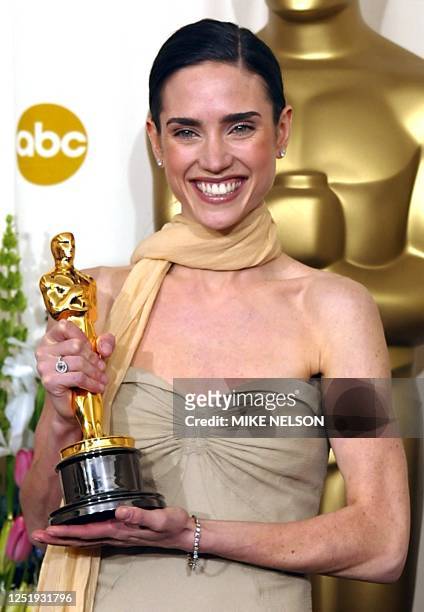 Actress Jennifer Connelly holds her Oscar or best actress in a supporting role for her portrayal of Alicia Nash, the wife of mathematician John Nash,...