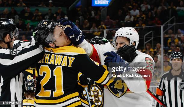 Garnet Hathaway of the Boston Bruins and Colin White of the Florida Panthers shove each other during the second period of Game One of the First Round...