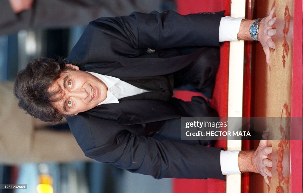 Academy Award winning actor Al Pacino print his hands in wet concrete