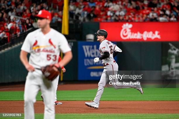 Pavin Smith of the Arizona Diamondbacks rounds the bases after hitting a grand slam against the St. Louis Cardinals in the seventh inning at Busch...