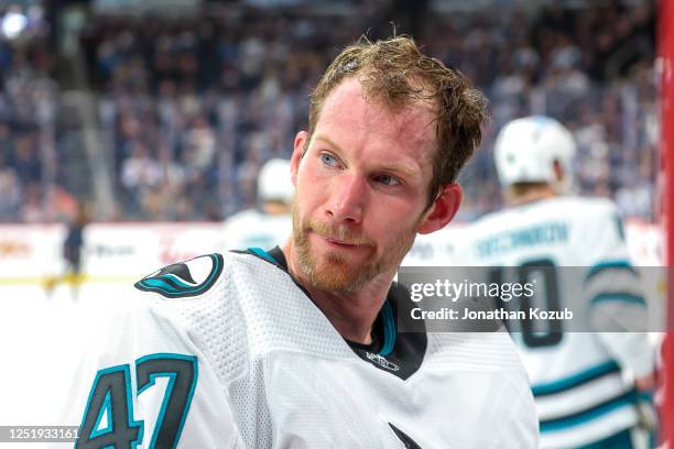 Goaltender James Reimer of the San Jose Sharks looks on during a second period stoppage of play against the Winnipeg Jets at Canada Life Centre on...