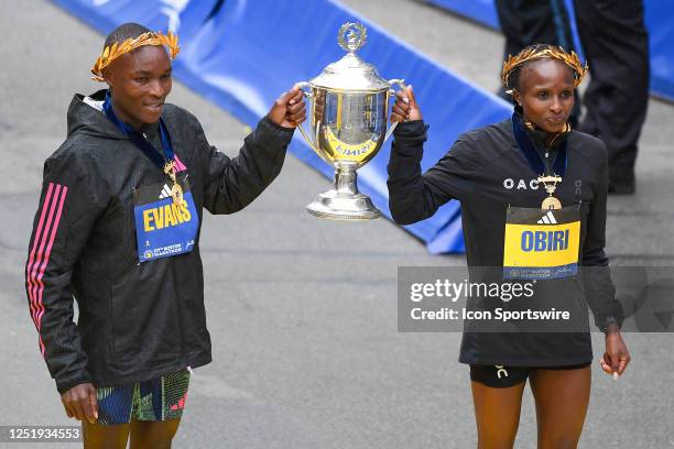 Evans Chebet of Kenya and Hellen Obiri of Kenya pose for photos after Chebet won the men's division and Obiri won the women's division of the 127th...