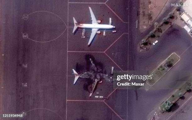 Maxar closeup satellite imagery of a destroyed Ukranian airplane at Khartoum International Airport in Sudan.. Please use: Satellite image 2023 Maxar...