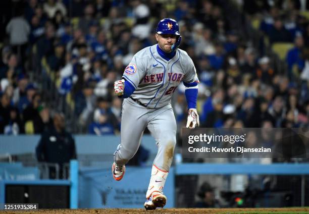 Pete Alonso of the New York Mets celebrates after hitting one run base hit as he runs to first base to score Starling Marte against relief pitcher...