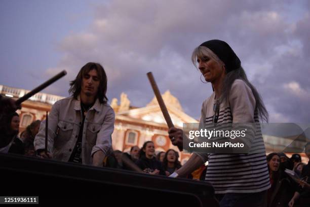 People play drums on a trash bin during the pot concert in toulouse. A few thousands people gathered in front of the Capitole in Toulouse for a pot...