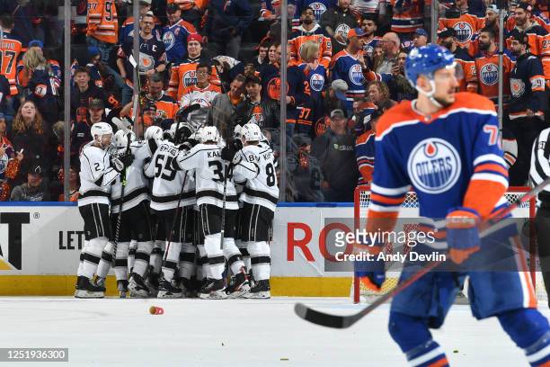Alex Iafallo of the Los Angeles Kings celebrates after scoring the game winning goal in overtime against the Edmonton Oilers with his teammates in...