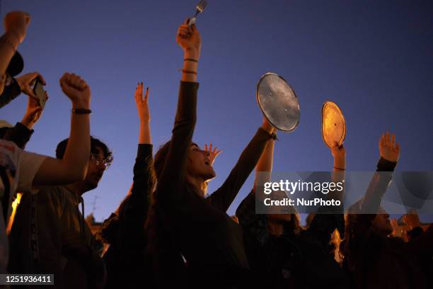 Protesters shout during the concert pot against Macron's speech. A few thousands people gathered in front of the Capitole in Toulouse for a pot...