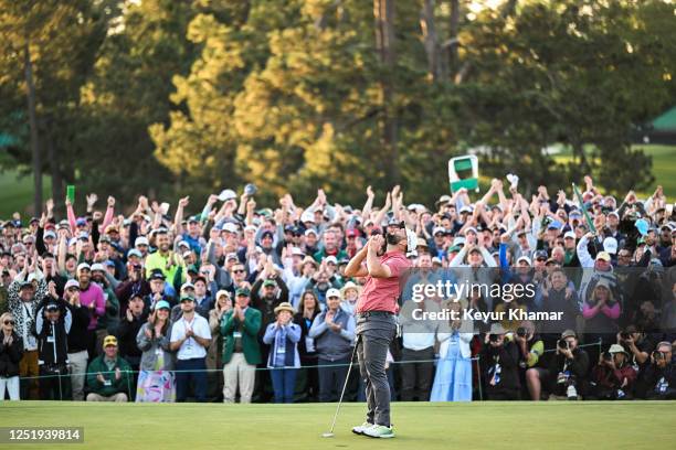 Jon Rahm of Spain reacts and celebrates in front of patrons after his four stroke victory on the 18th hole green during the final round of the 2023...