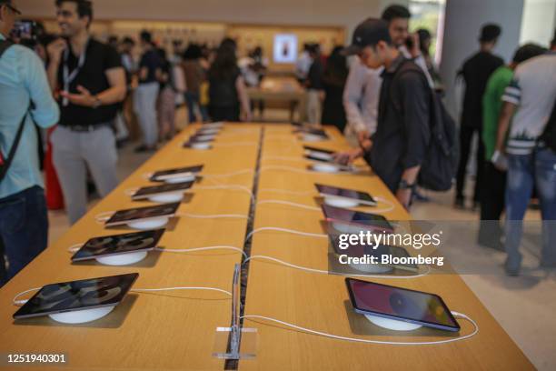 Customers browse iPads in Mumbai, India, on Tuesday, April 18, 2023. Chief Executive Officer Tim Cook officially opened Apple Inc.'s first...