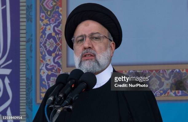 Iranian President Ebrahim Raisi addressed while attending a military parade marking Iran's Army Day anniversary near the Imam Khomeini shrine in the...