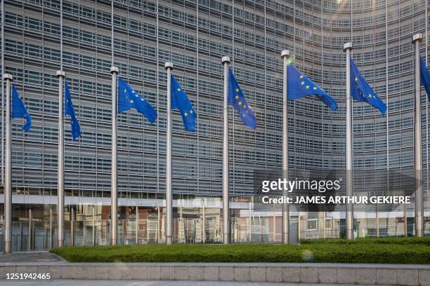 Illustration shows European flags at the Berlaymont which houses the headquarters of the European Commission, the executive branch of the European...