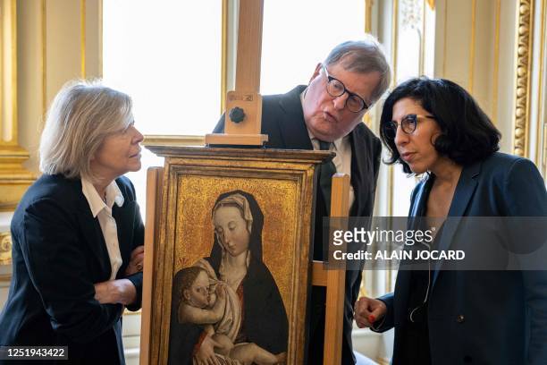 French Culture Minister Rima Abdul-Malak poses next to Felix de Marez Oyens and his wife Theodora de Marez Oyens, representing the heirs of Ernst and...