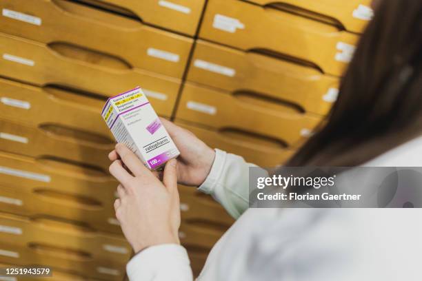 An employee in a pharmacy is pictured with antibiotic agent on April 13, 2023 in Niesky, Germany.