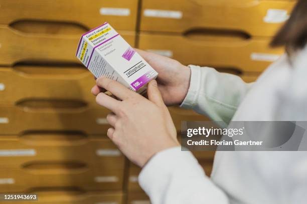 An employee in a pharmacy is pictured with antibiotic agent on April 13, 2023 in Niesky, Germany.