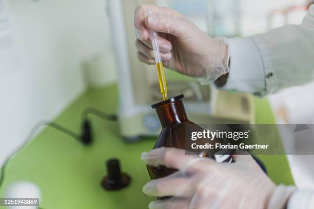 An employee of a pharmacy makes balm in a small-scale preparation on April 13, 2023 in Niesky, Germany.