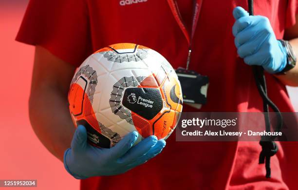 Ball boy brings out the match balls prior to the Premier League match between Manchester United and Sheffield United at Old Trafford on June 24, 2020...