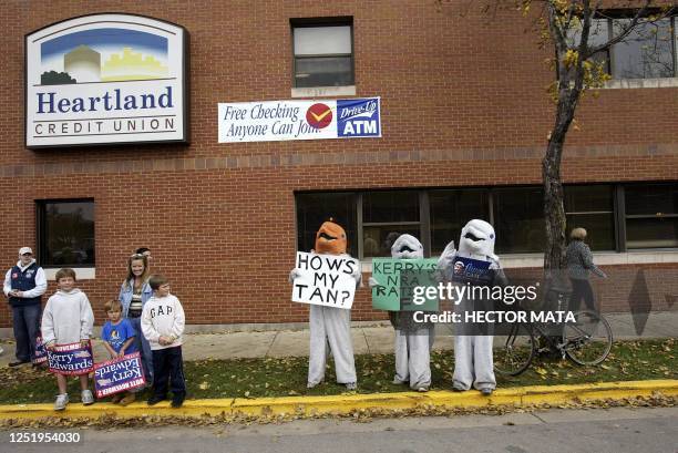 Supporters of US President George W Bush wearing dolphin costumes, demonstrate during a rally featuring Democratic presidential candidate John Kerry...