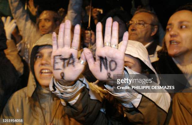 Girl shows her hands marked with "Eta, no" denouncing the separatist organization Eta during the demonstration against terrorism, in memory of the...