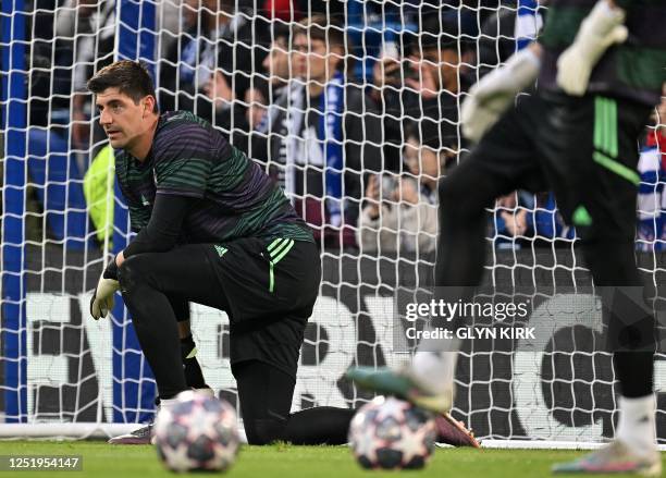 Real Madrid's Belgian goalkeeper Thibaut Courtois warms up ahead of the Champions League quarter-final second-leg football match between Chelsea and...