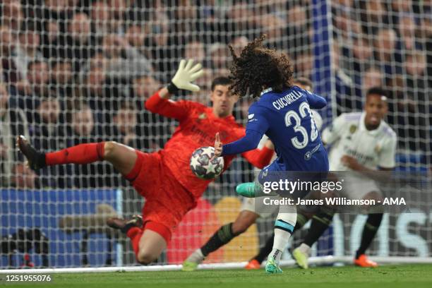Thibaut Courtois of Real Madrid saves from Marc Cucurella of Chelsea during the UEFA Champions League quarterfinal second leg match between Chelsea...