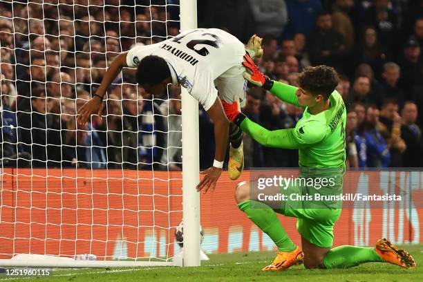 Rodrygo of Real Madrid tangles with Kepa Arrizabalaga of Chelsea after scoring a goal to make the score 0-2 during the UEFA Champions League...