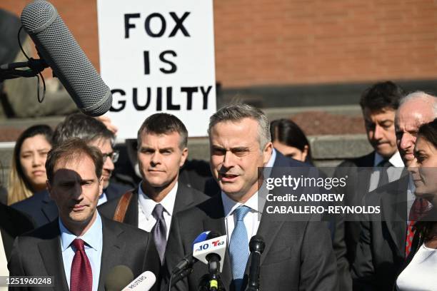 Dominion CEO John Poulos, joined by members of the Dominion Voting Systems legal team, speaks to members of the media outside the Leonard Williams...