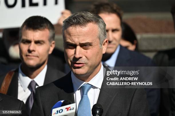 Dominion CEO John Poulos, joined by members of the Dominion Voting Systems legal team, speaks to members of the media outside the Leonard Williams...