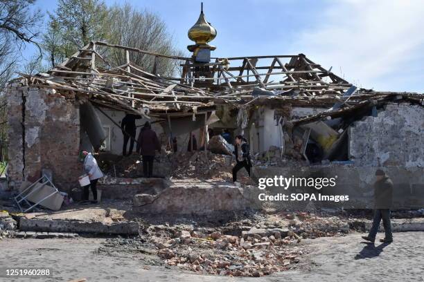 People clear the rubble after a Russian rocket destroyed an Orthodox church on Easter night in Komyshuvakha. In recent weeks, the UK Ministry of...