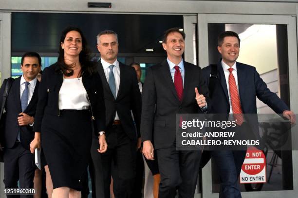 Justin Nelson , joined by fellow members of the Dominion Voting Systems legal team, depart the Leonard Williams Justice Center in Wilmington,...