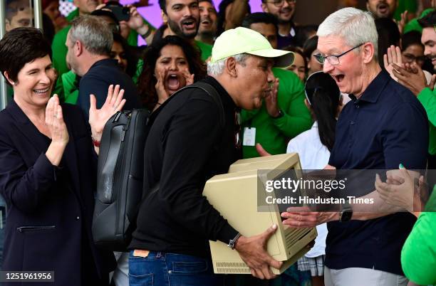 Tim Cook, CEO, Apple Inc, gets excited after seeing, old Macintosh Classics 1984 model brought by Mac user Sajid Moinuddin, from Goregaon, who was...