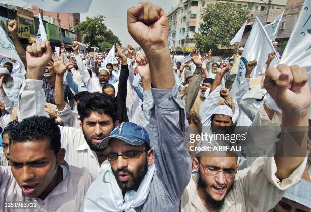 Activists of Pakistan's six-party Islamic alliance Muttahida Majlis-e-Amal chant slogans during a protest against Israeli air strikes on Lebanon and...
