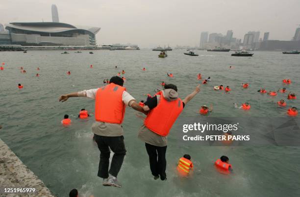South Korean protesters join their comrades in Victoria harbour during a demonstration in Hong Kong, 13 December 2005 on the first day of WTO talks...