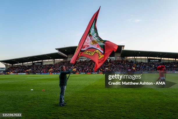 General view of the Racecourse Ground, the home stadium of Wrexham with a flag of the Wrexham badge being waved during the Vanarama National League...