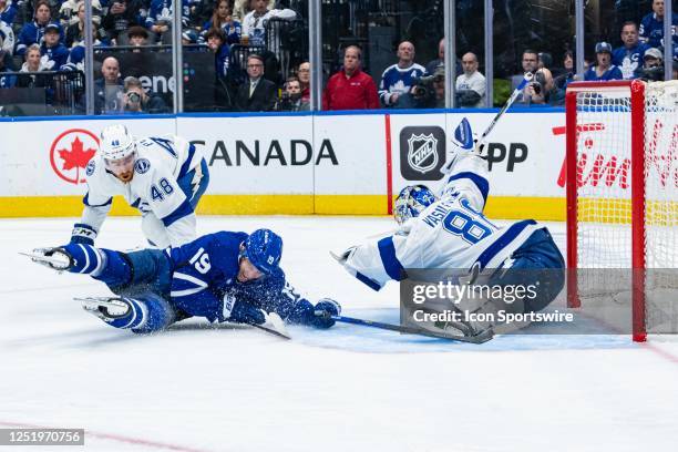 Tampa Bay Lightning Goalie Andrei Vasilevskiy makes a save as Toronto Maple Leafs Winger Calle Jarnkrok falls to the ice during the third period of...