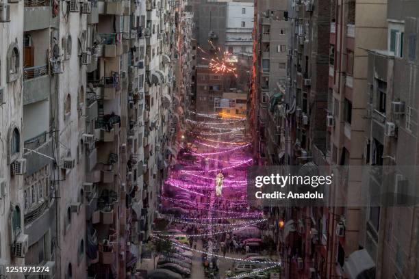 People have iftar meal together by sharing the food they brought from their homes with their neighbors and friends during the last days of the holy...