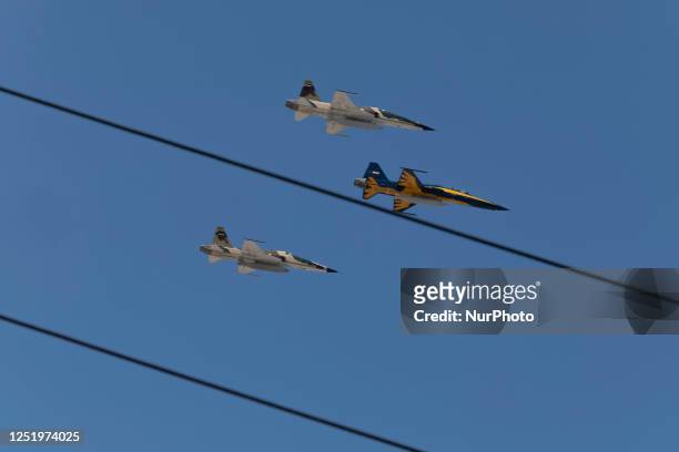 Iranian-made Fighter jets of the Iranian Army fly past during a military parade marking Iran's Army Day anniversary near the Imam Khomeini shrine in...