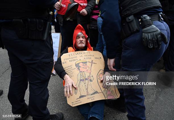 French gendarmes surround demonstrators during a protest against a visit of French President Emmanuel Macron to Mathis, a company specialised in...