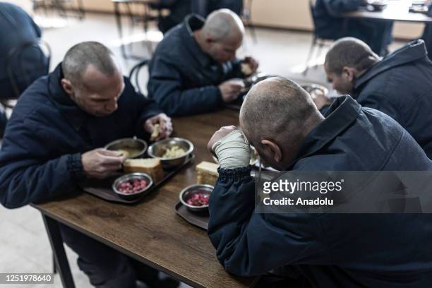 Group of Russian soldiers captured during the war in Ukraine has a meal in A Ukrainian prison in western Ukraine, Ukraine on April 18, 2023.