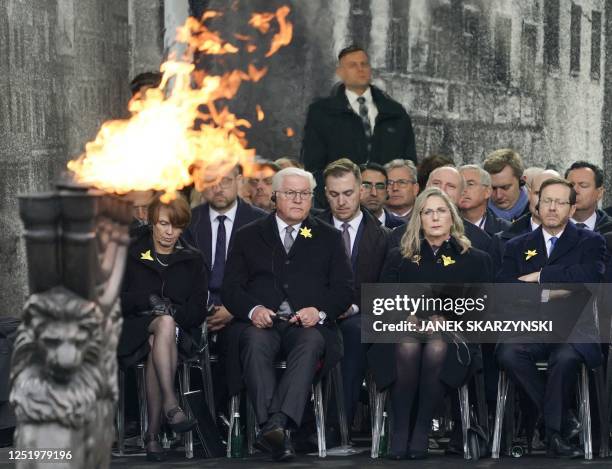 Polish President Andrzej Duda delivers a speech as his wife Agata Kornhauser-Duda, Israel's President Isaac Herzog and his wife Michal Herzog and...