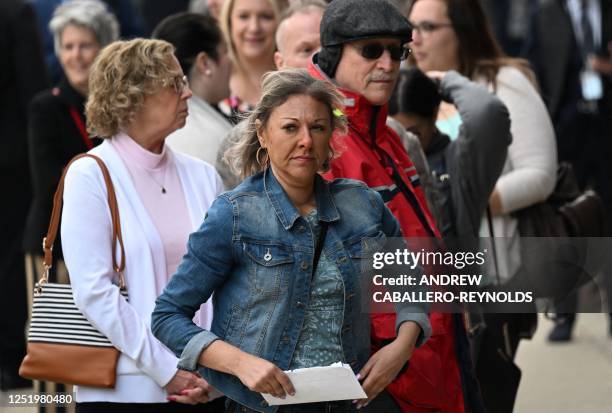 Members of the public wait to enter the Leonard Williams Justice Center where the Dominion Voting Systems defamation trial against FOX News is taking...