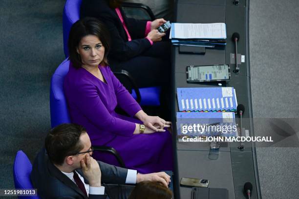 German Foreign Minister Annalena Baerbock looks on as she attends a session of questions at the Bundestag, the German lower house of parliament, in...