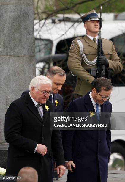 German President Frank-Walter Steinmeier , Polish President Andrzej Duda , and Israel's President Isaac Herzog leave after laying wreaths at The...