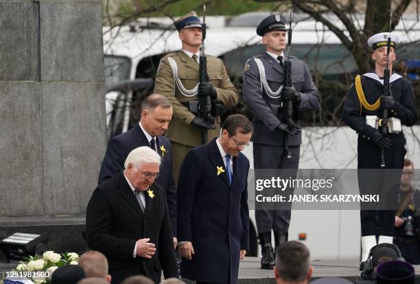 German President Frank-Walter Steinmeier , Polish President Andrzej Duda , and Israel's President Isaac Herzog leave after laying wreaths at The...