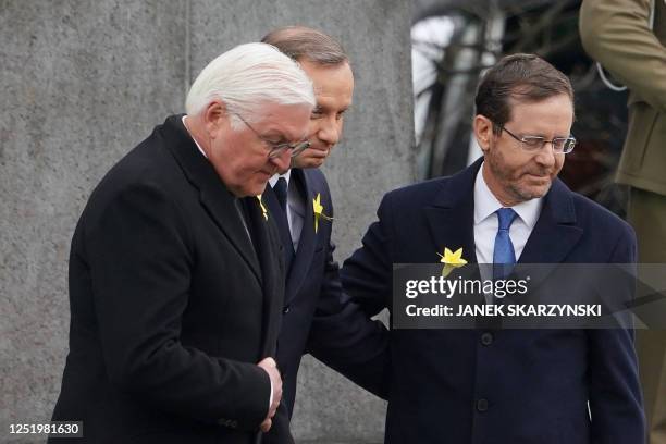 German President Frank-Walter Steinmeier , Polish President Andrzej Duda , and Israel's President Isaac Herzog leave after laying wreaths at The...