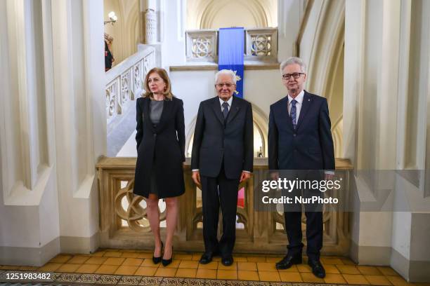 Sergio Mattarella, the President of Italy and his daughter Laura Mattarella pose for a picture with Jacek Popiel, the rector of the Jagiellonian...