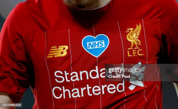 Harvey Elliott of Liverpool looks on while the NHS logo is seen on his shirt during the Premier League match between Liverpool FC and Crystal Palace...